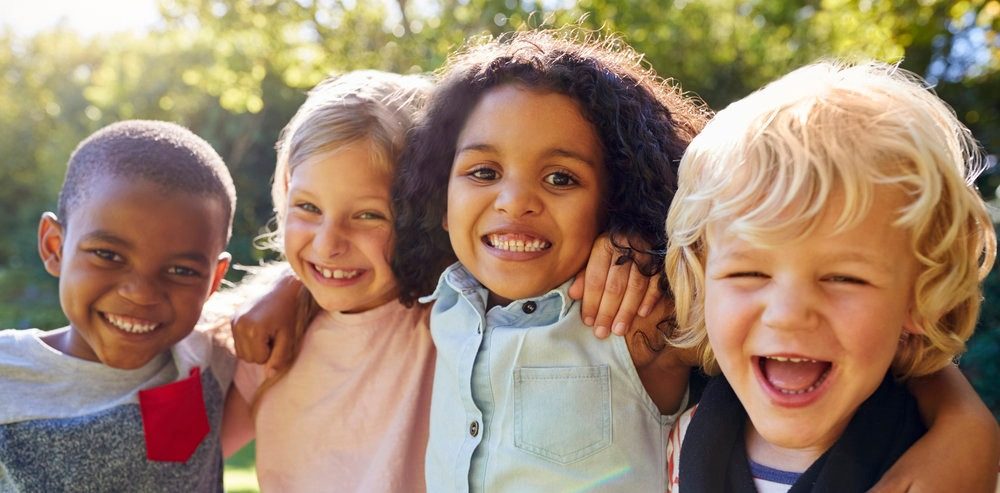 Smiling children together outdoors at Always Active